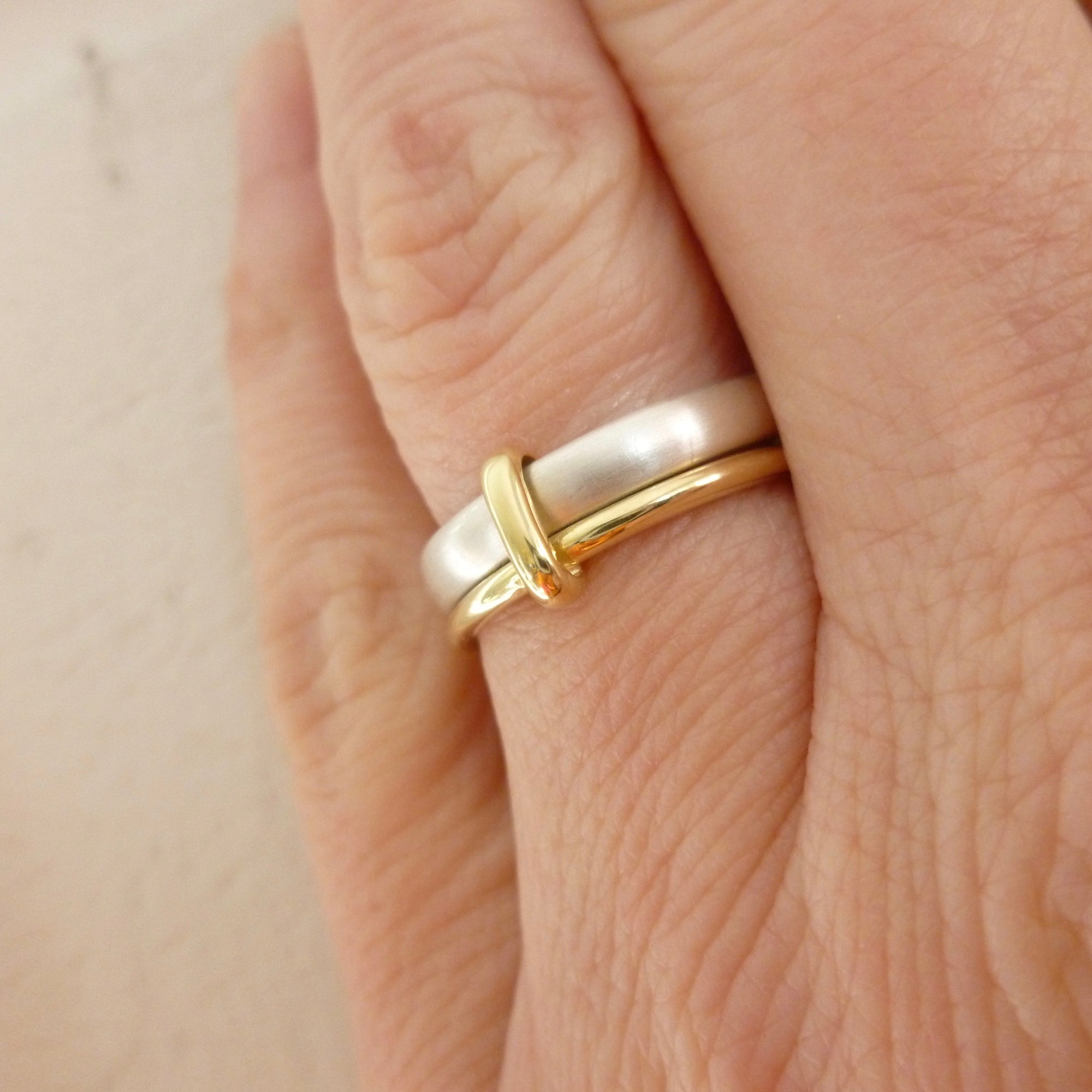 Simple and modern handmade two band stacking ring in silver and gold, an alternative wedding or dress ring