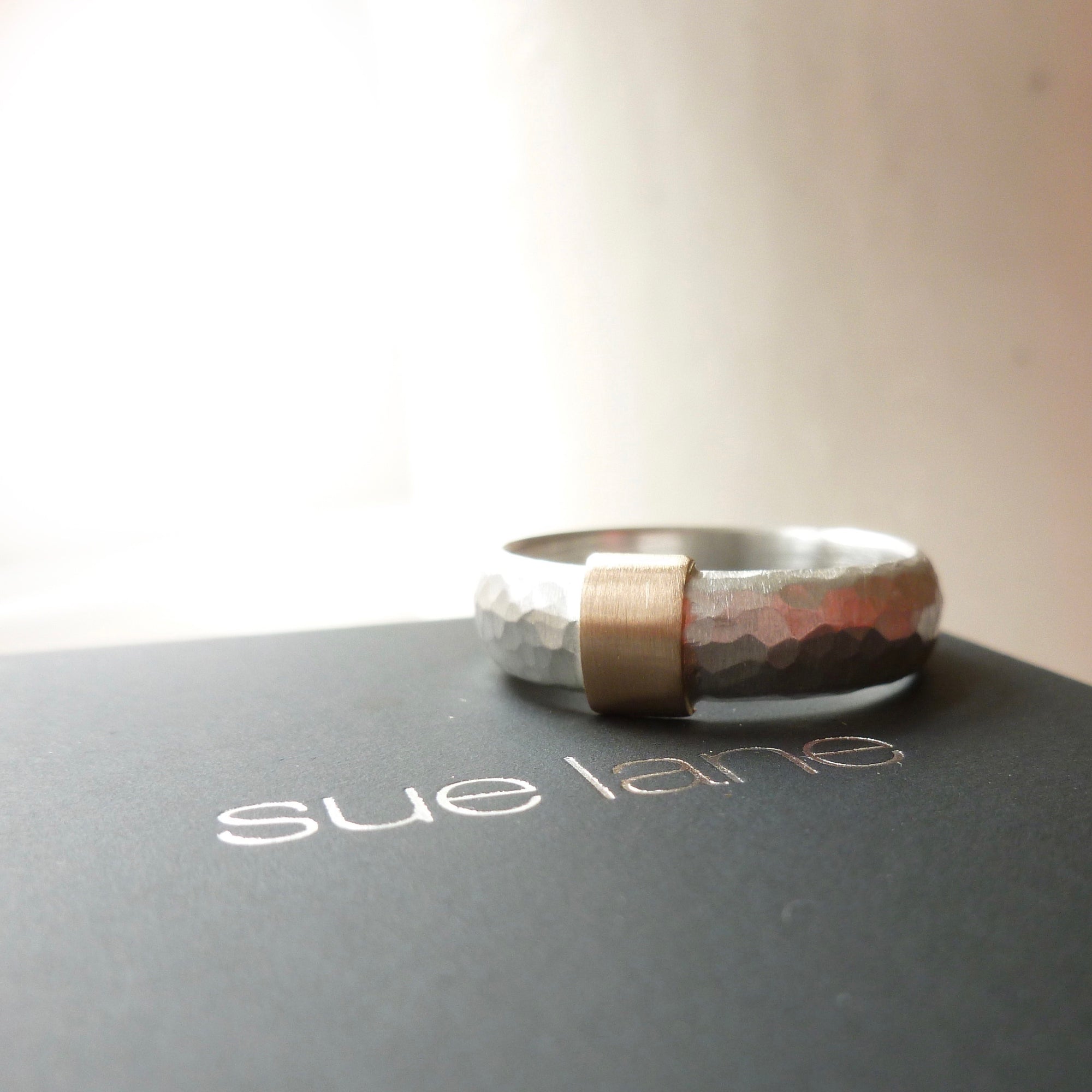 modern and unusual two tone silver and gold chinky ring for men or woman with a hammered finish. Handmade in UK