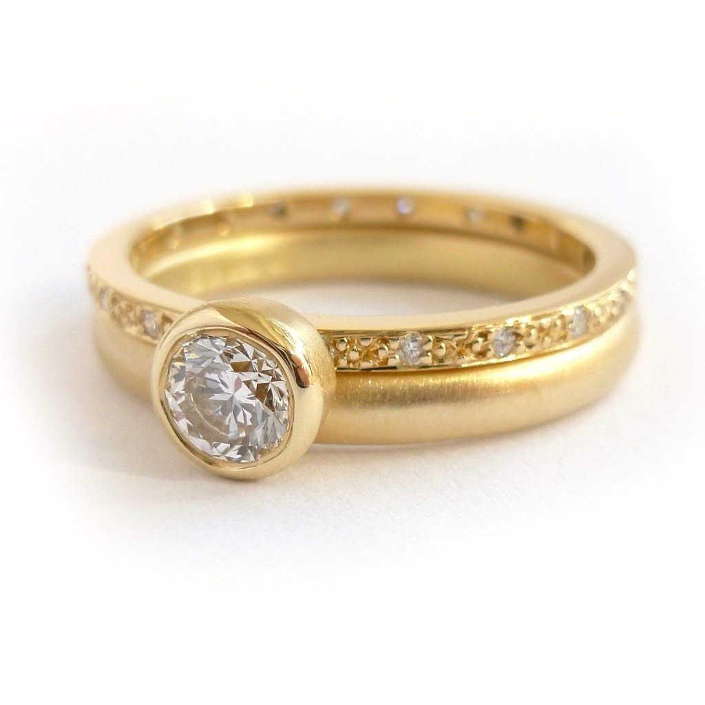 Modern two band diamond ring alternative modern engagement ring Sue Lane. Modern alternative engagement wedding ring - gold and diamond two band ring. Multi band ring or interlocking ring, sometimes called double band ring too.