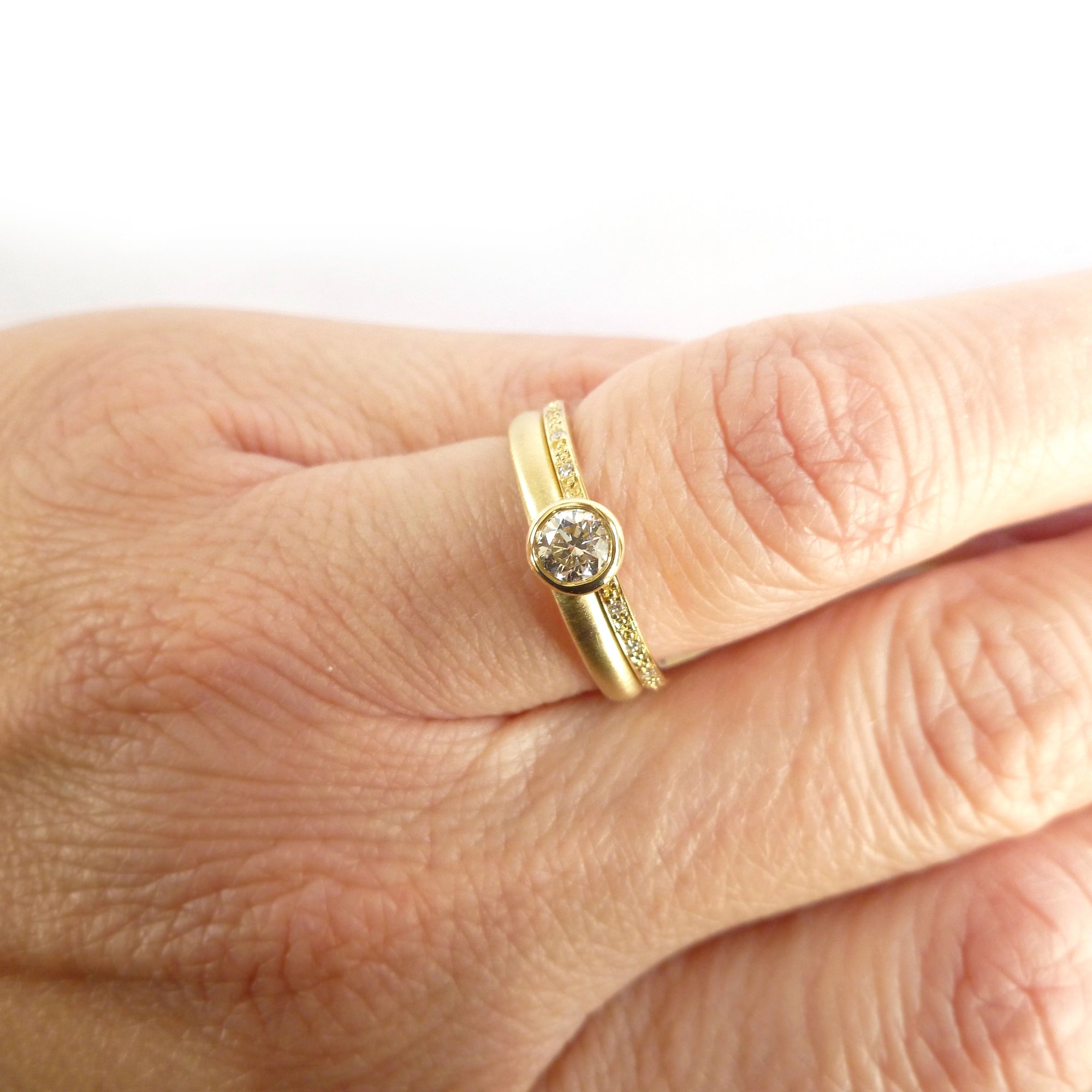 Modern two band diamond ring alternative modern engagement ring Sue Lane. Multi band ring or interlocking ring, sometimes called double band ring too.
