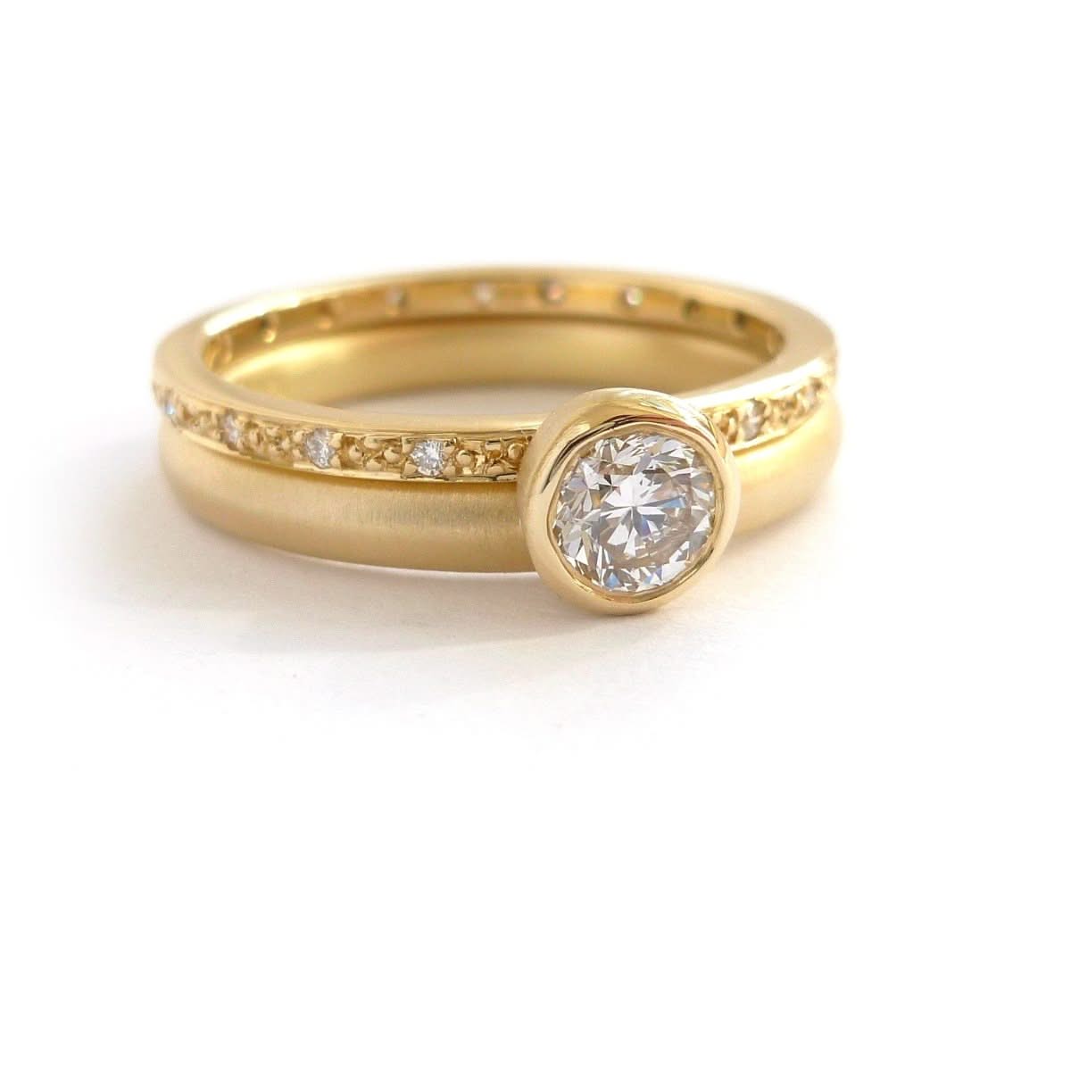 Modern two band diamond ring alternative modern engagement ring Sue Lane. Multi band ring or interlocking ring, sometimes called double band ring too.