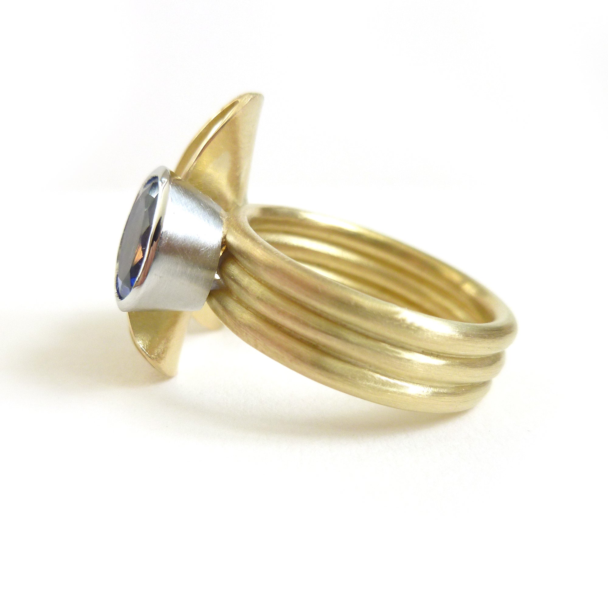 gold and oval tanzanite dress ring 