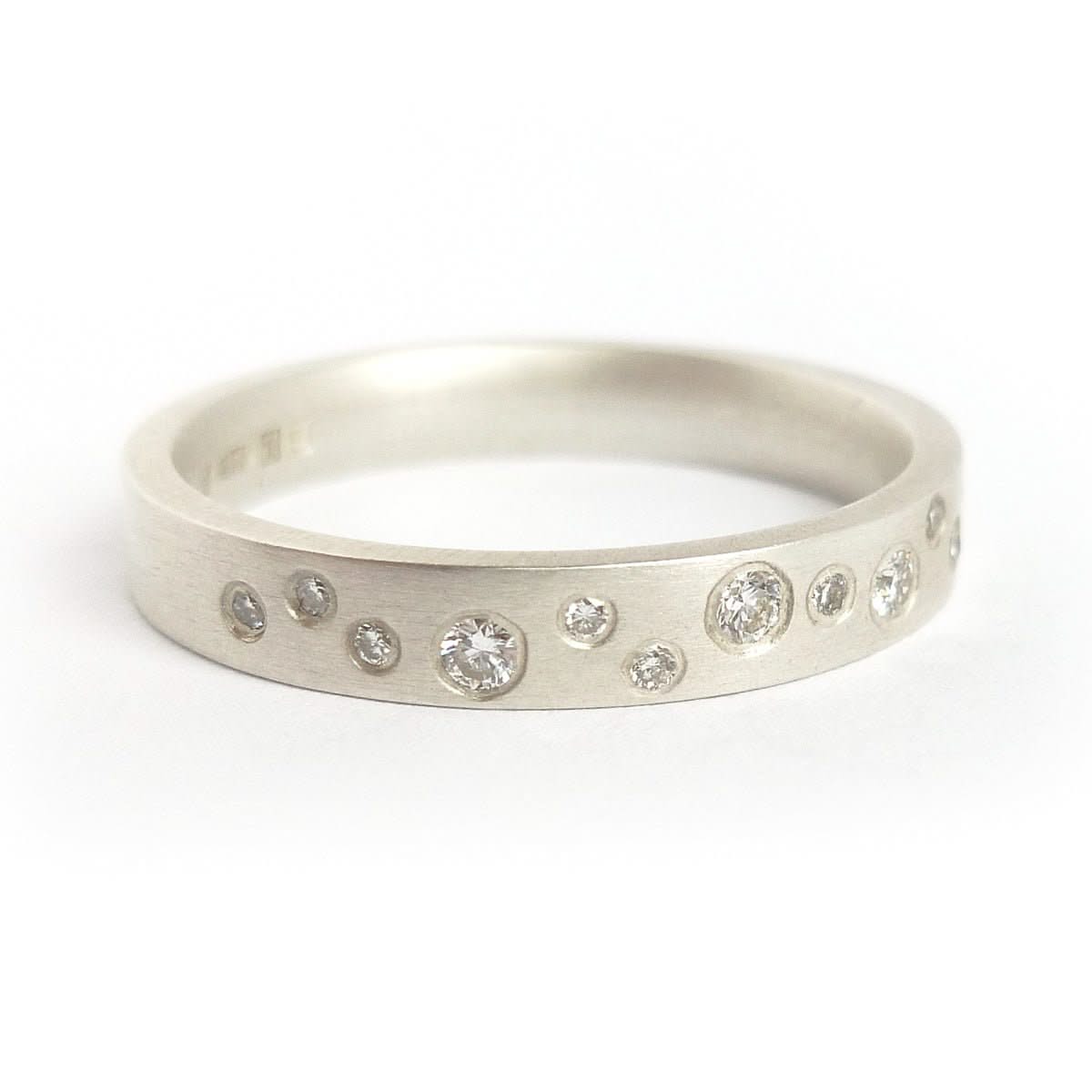Handmade modern silver eternity ring with flush set diamonds by Sue Lane