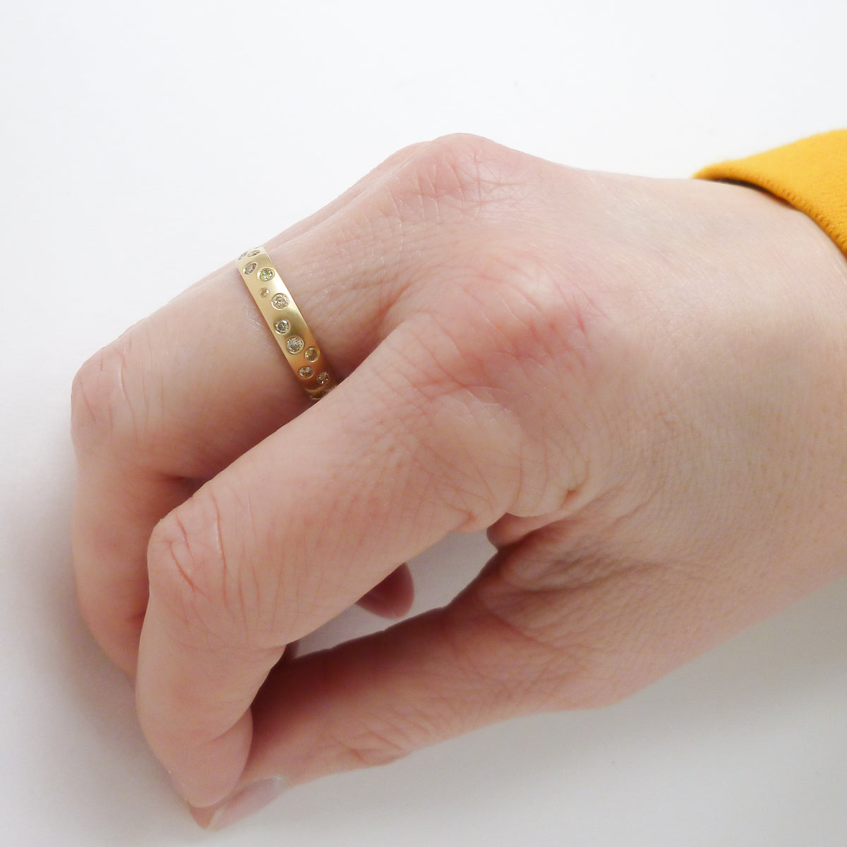A modern, contemporary gold eternity ring, wedding ring, or engagement ring by Sue Lane