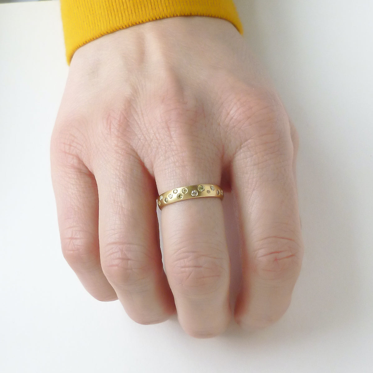 A modern, contemporary gold eternity ring, wedding ring, or engagement ring by Sue Lane