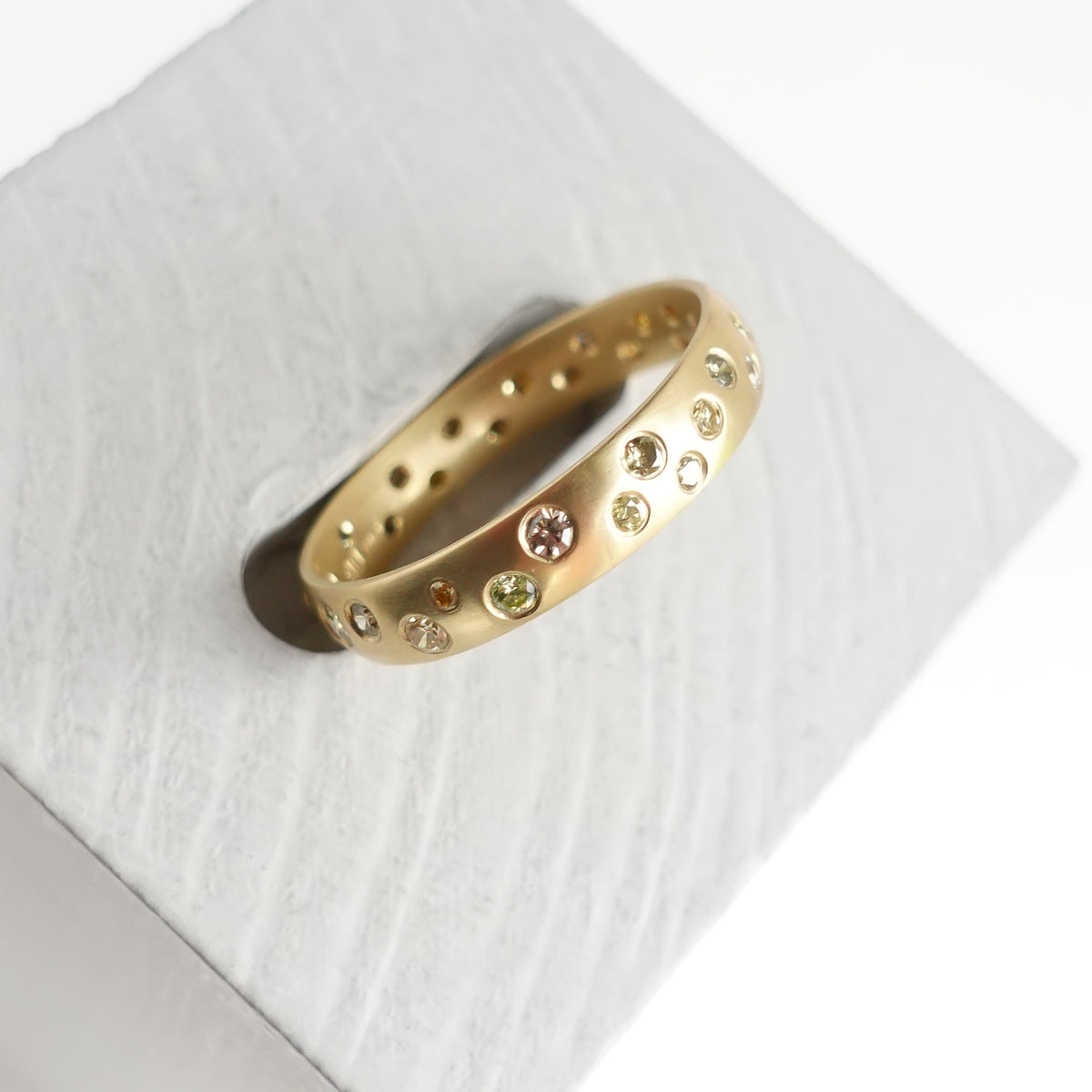 A modern, contemporary gold eternity ring, wedding ring, or engagement ring by Sue Lane