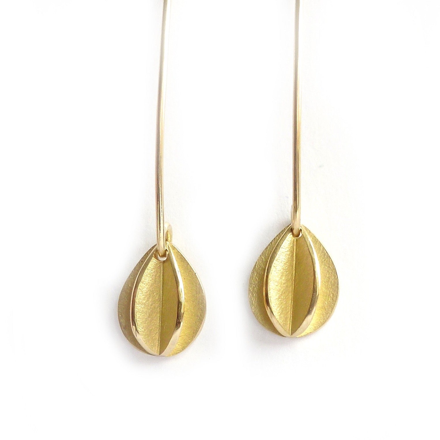 simple modern leaf hook earrings in yellow gold handmade with a brushed finish