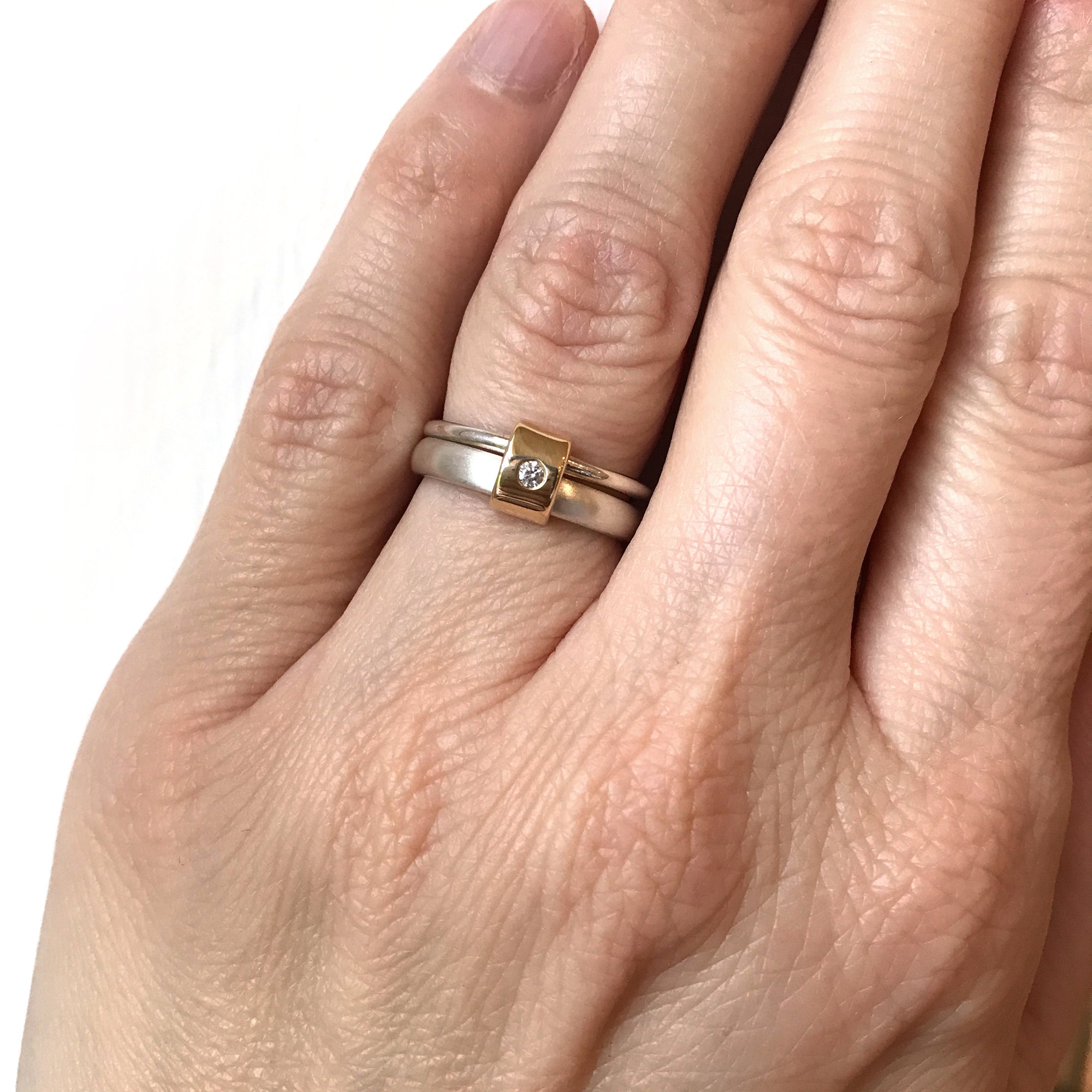 modern contemporary silver and gold two band stacking ring