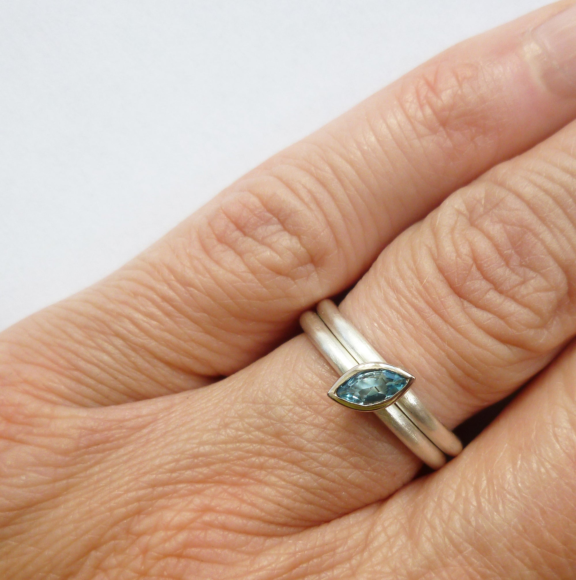 alternative modern silver and gold marquise aquamarine eternity stacking ring