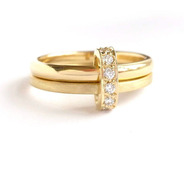 Modern two band ring joined together with a row of pave set diamonds, making a unique commitment ring or eternity ring. Multi band ring or interlocking ring, sometimes called double band ring too.
